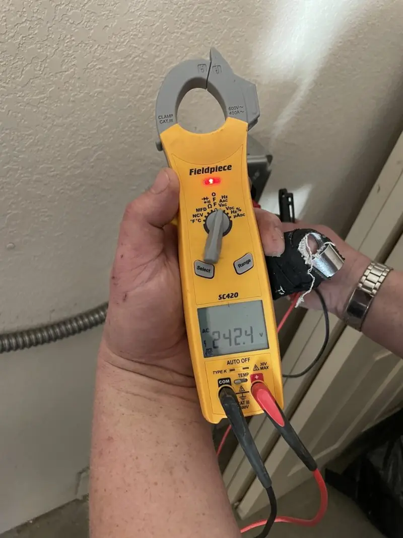 Voltage testing with clamp meter during Electrical Installation Services in Auburn Lake Trails